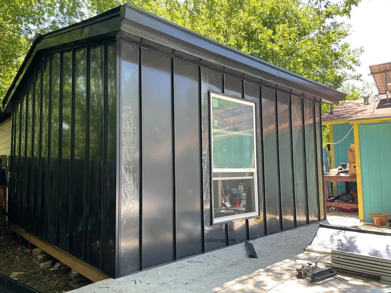 Black standing seam metal wall panels for Roof Inspection in Mexia