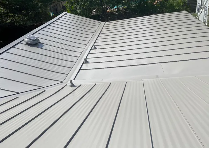 Solar attic fan installed on a metal roof for Roof Ventilation in Mexia